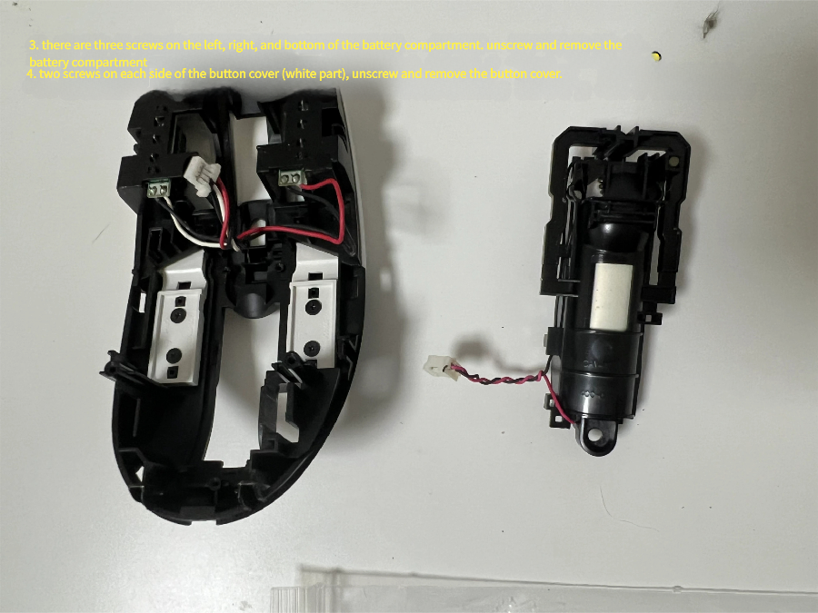 White button covers removed to access switches (mouse switch access)